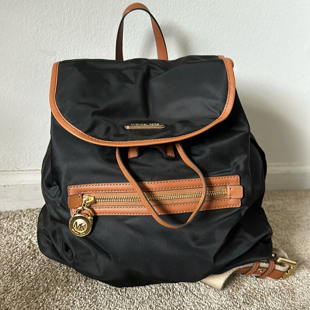 Michael Kors - black nylon backpack with gold hardware.